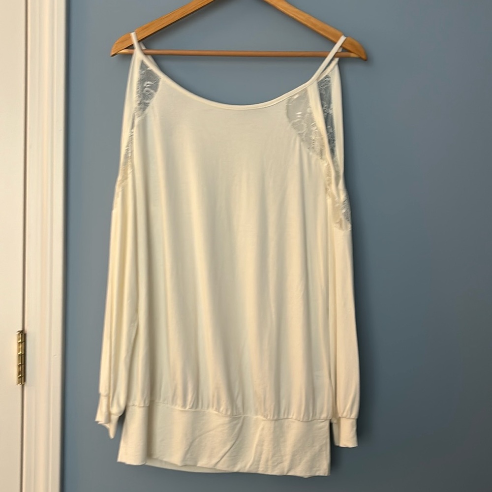 Off White ladies top with Lace at top and cutout at shoulders. NWOT